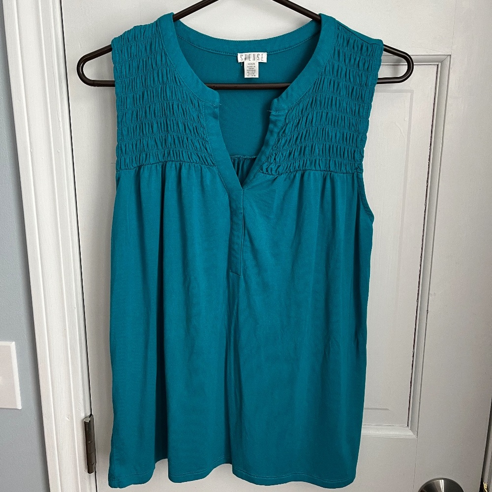 Beautiful teal color sleeveless blouse, Size M